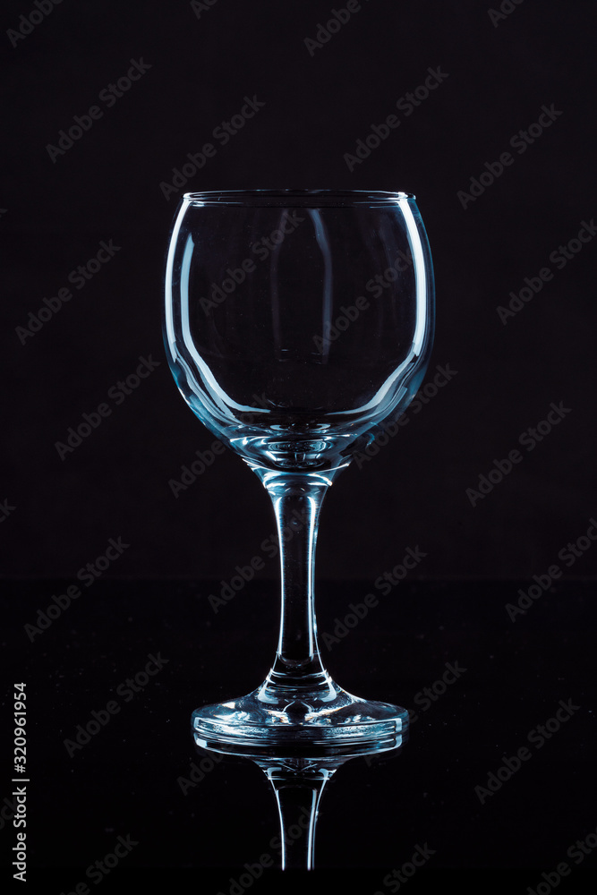 Wine glass on black background, front view Wine glass on black background, front view