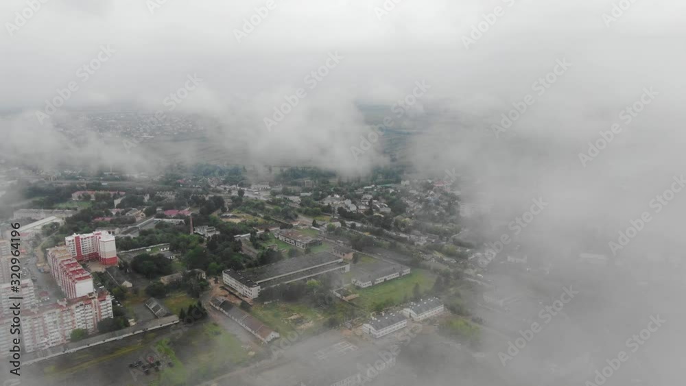 Aerial View of a City in Eastern Europe Ascending Through Clouds Aerial View of a City in Eastern Europe Ascending Through Clouds