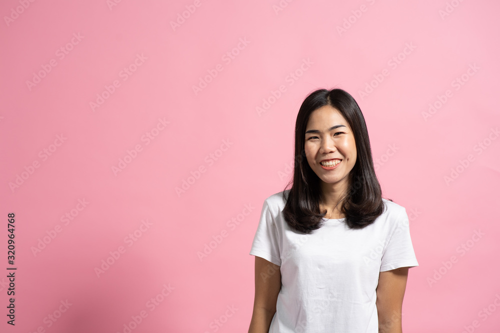 Portrait of a happy girl showing a gesture on a pink background Portrait of a happy girl showing a gesture on a pink background
