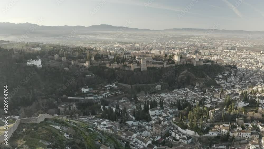 Drone flight approaching The Alhambra from the San Miguel viewpoint in the Albaicín de Granada. Andalusia. Spain Drone flight approaching The Alhambra from the San Miguel viewpoint in the Albaicín de Granada. Andalusia. Spain
