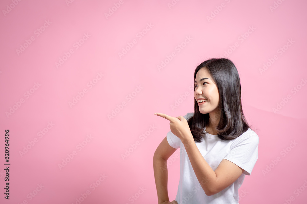 Portrait of a happy girl showing a gesture on a pink background Portrait of a happy girl showing a gesture on a pink background