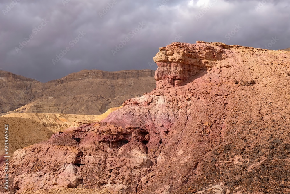 Scenic red sandstone cliff in Negev desert, Israel. Scenic red sandstone cliff in Negev desert, Israel.