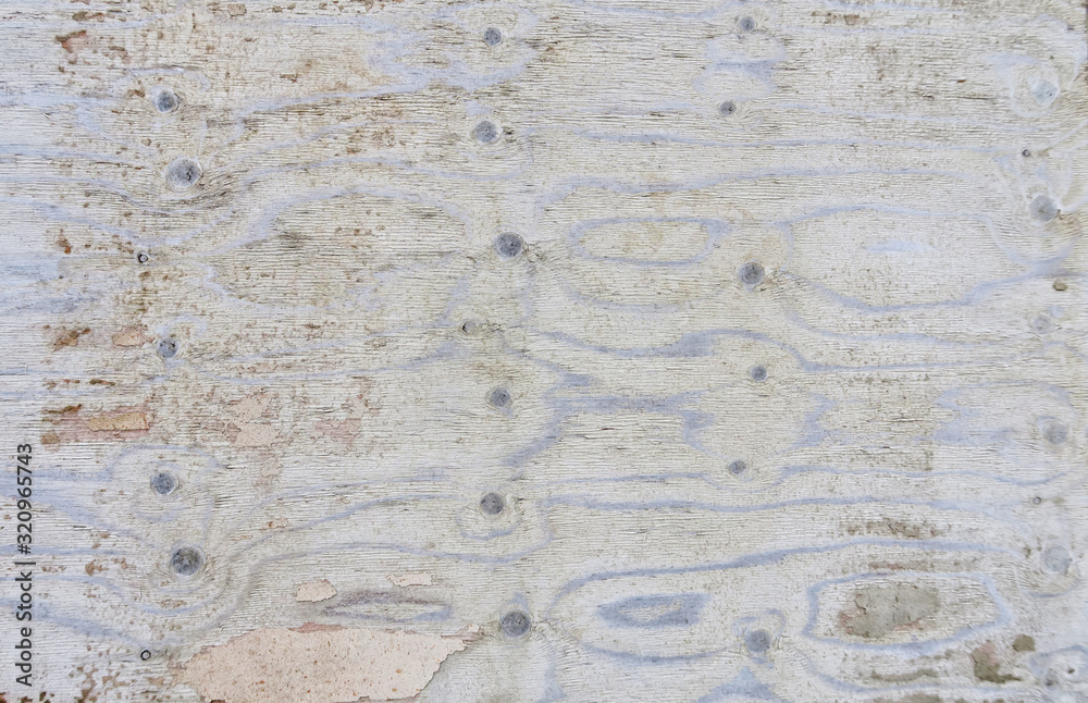 Old cracked plywood with a beautiful texture. Frame with an unusual background and free space for ad, advertisement. Old cracked plywood with a beautiful texture. Frame with an unusual background and free space for ad, advertisement.