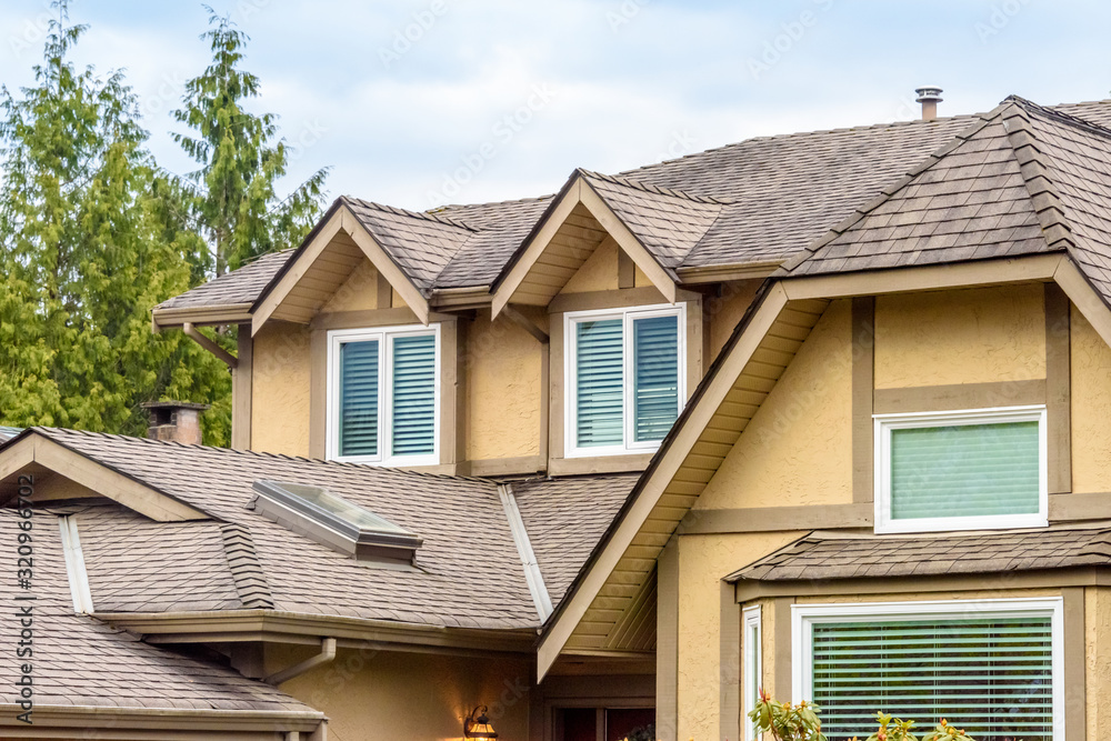 The roof of the house with nice window.