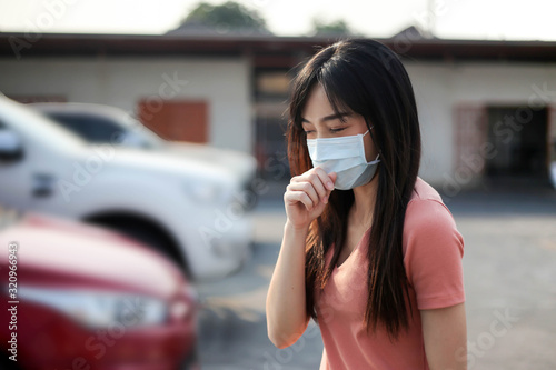 Beautiful asia  Woman suffer from sick and wearing face mask  protect filter against air pollution (PM2.5),Air pollution caused health problem,anti smog and viruses