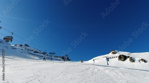 Hochzillertal - Austria Snowboarding skiing slow motion takes on a sunny day at 4k 30fps featuring a first time snowboarding. photo