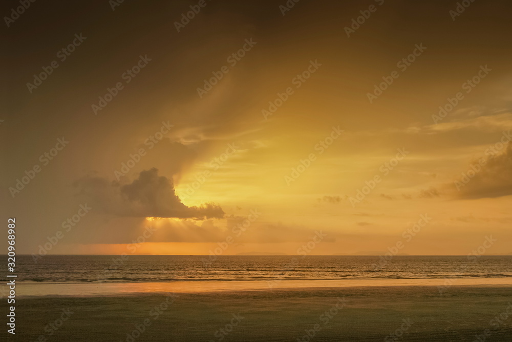 Sunset While Raining view seaside of dark clouds moving above the sea with soft rain and ...