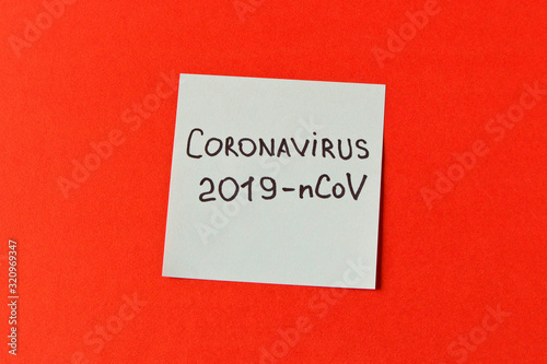 Coronavirus. Sticker with the inscription coronavirus on a red background. The concept of protection from the virus. Selective focus.
