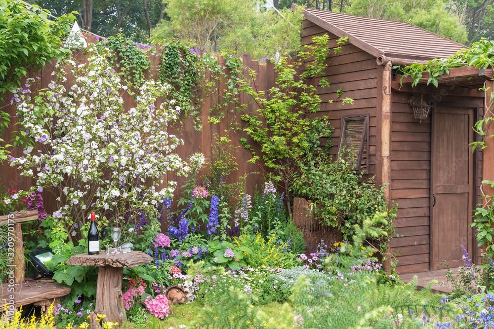 Backyard flower garden of old residential house Backyard flower garden of old residential house