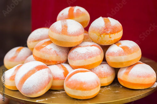 Photography A pile / pyramid of smaller sized Krapfen (so-called Puppenkrapfen - a kind of doughnut)