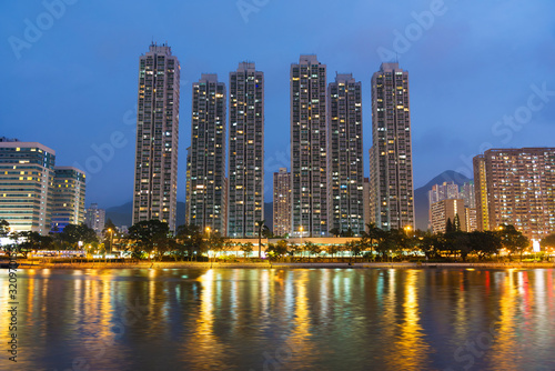 High rise residential building and river in Hong Kong city at dusk © leeyiutung