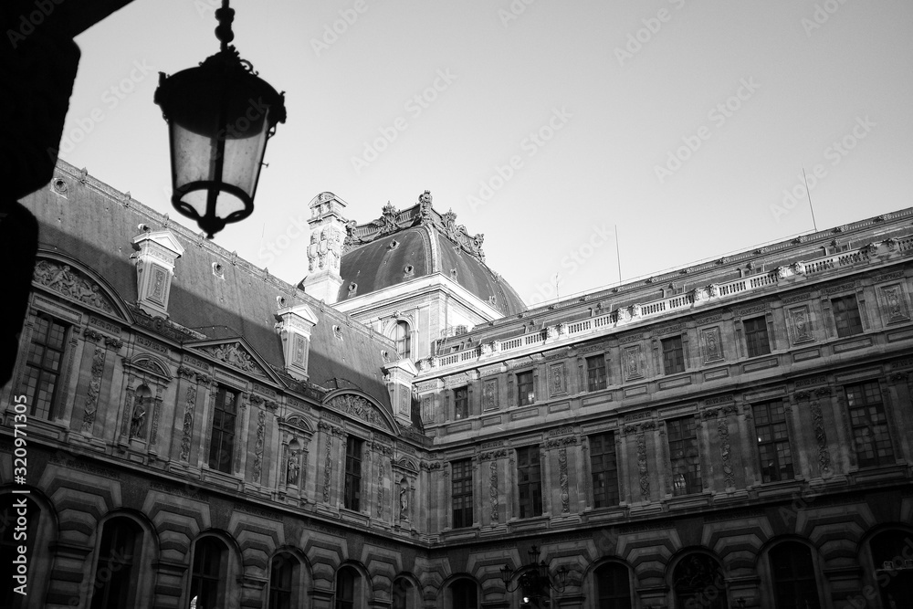 The Louvre museum courtyard, in black and white.