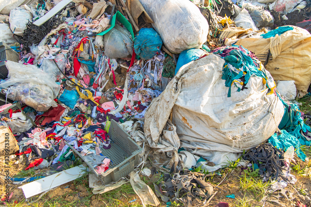 dump garbage background waste trash plastic and clothes global
