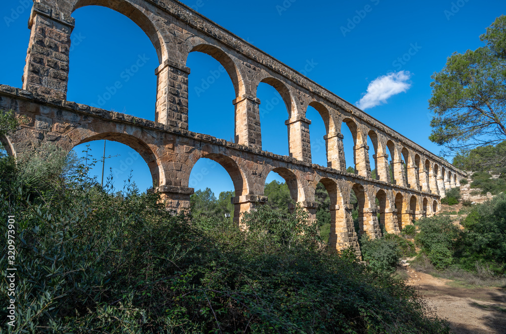 Ancient roman aqueduct Ponte del Diable or Devil's Bridge in Tarragona, Spain.