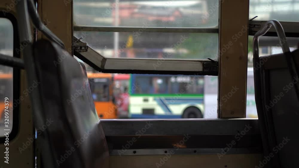 View from inside old shaky open air bus in Bangkok, Thailand View from inside old shaky open air bus in Bangkok, Thailand