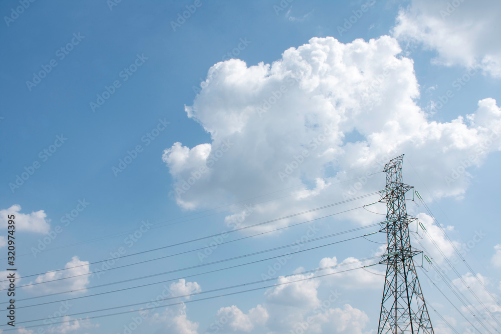 Electricity pole against blue sky clouds, Transmission line of electricity to rural with green tree, High voltage electricity pole with nature background, electricity transmission pylon Electricity pole against blue sky clouds, Transmission line of electricity to rural with green tree, High voltage electricity pole with nature background, electricity transmission pylon