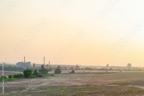 Industrial factory background with sunset sky