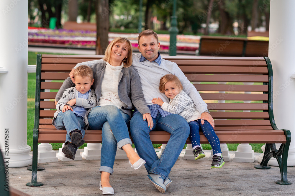 Happy family having fun together in the park outdoor Happy family having fun together in the park outdoor