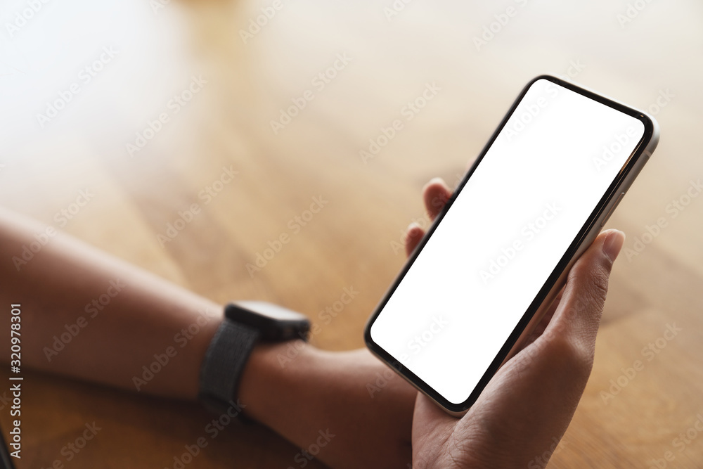 close-up on hand holding smart phone white screen display close-up on hand holding smart phone white screen display