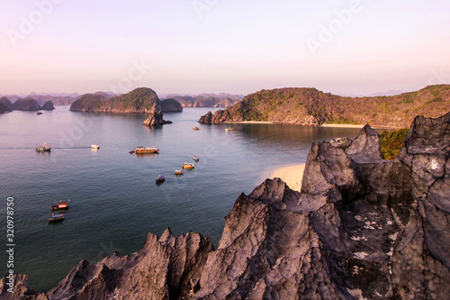 Early in the evening, Halong Bay is filled with soft rays of the crimson sun. The view from the top of the Monkey Island is amazing.