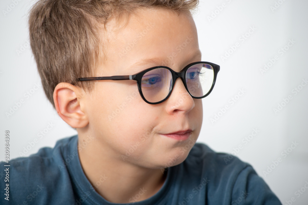 portrait of a pensive boy with glasses portrait of a pensive boy with glasses