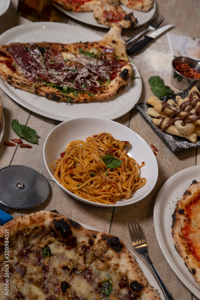 Variety of traditional Italian dishes. Isolated image. Mediterranean cuisine. Vertical Image Variety of traditional Italian dishes. Isolated image. Mediterranean cuisine. Vertical Image