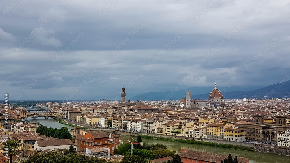 Panorama of Florence rooftops on a cloudy day.