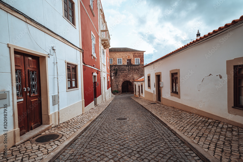 Cute cobblestone narrow streets and sidewalks in Silves, Portugal on a winter day Cute cobblestone narrow streets and sidewalks in Silves, Portugal on a winter day