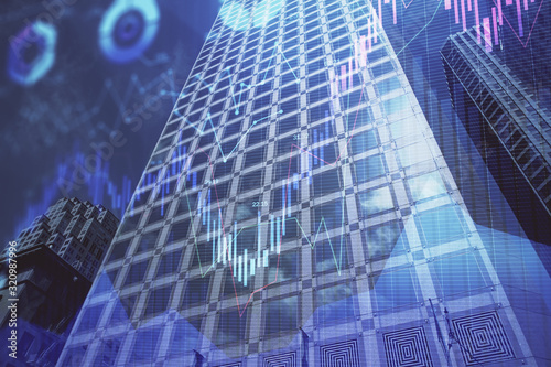 Forex chart on cityscape with tall buildings background multi exposure. Financial research concept.