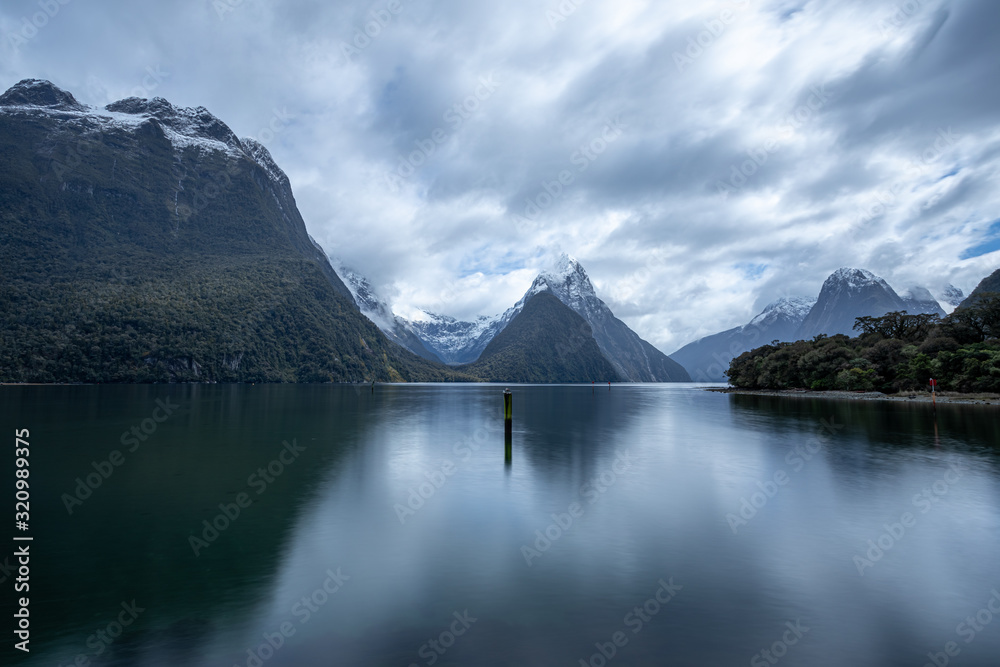 A long exposure photo of Mitre Peak in Milford Sound on a very cloudy day.