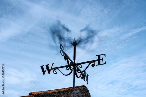 Weather vane spinning in strong wind