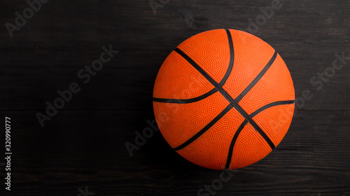 Basketball isolated over black background © PEPPERSMINT