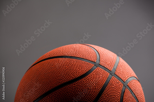 Basketball isolated over grey background © PEPPERSMINT