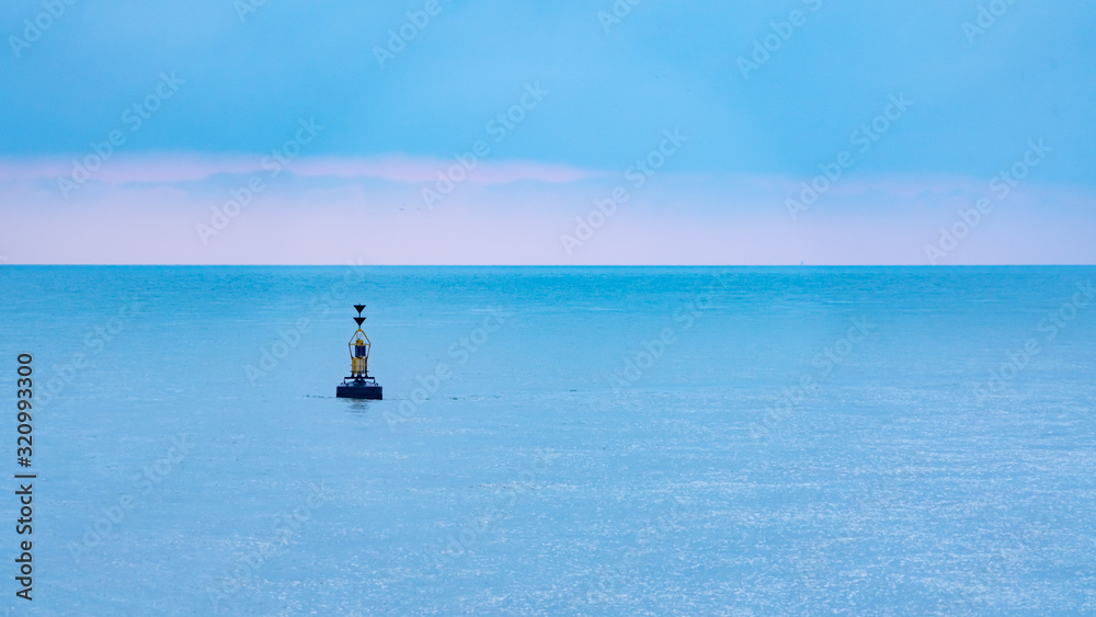 Fototapeta premium Small marker bouy sitting in the English channel