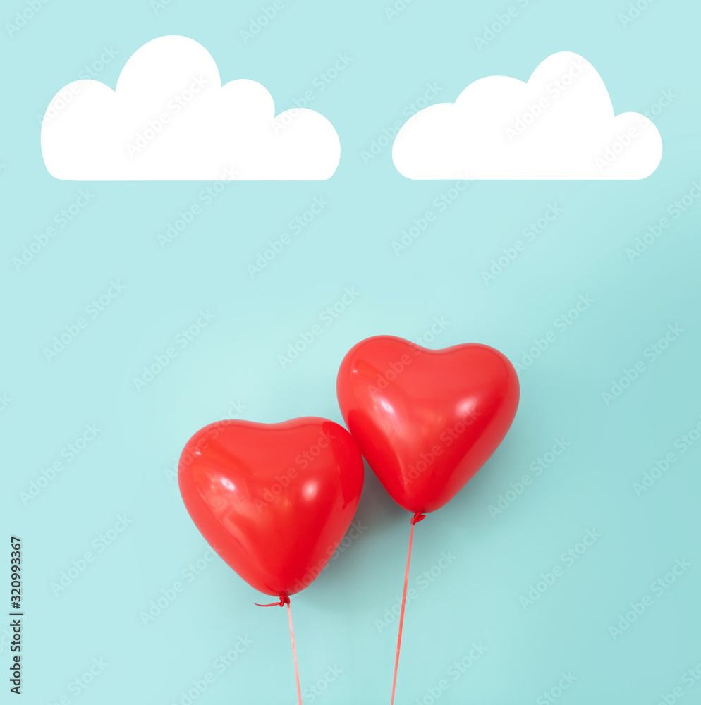 Two heart shaped red air baloon front of a font. Valentined day and romance concept. Two heart shaped red air baloon front of a font. Valentined day and romance concept.