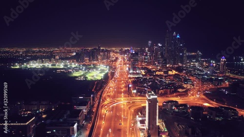 Wallpaper Mural Aerial night illuminated Dubai city skyline skyscrapers view and  busy traffic on Sheikh Zayed road  highway Torontodigital.ca