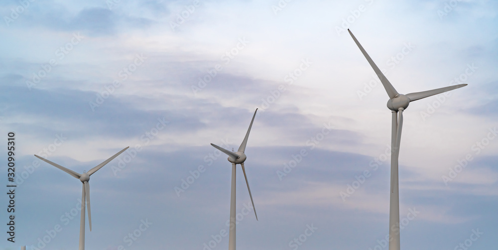 3 small wind turbines on winters evening 3 small wind turbines on winters evening