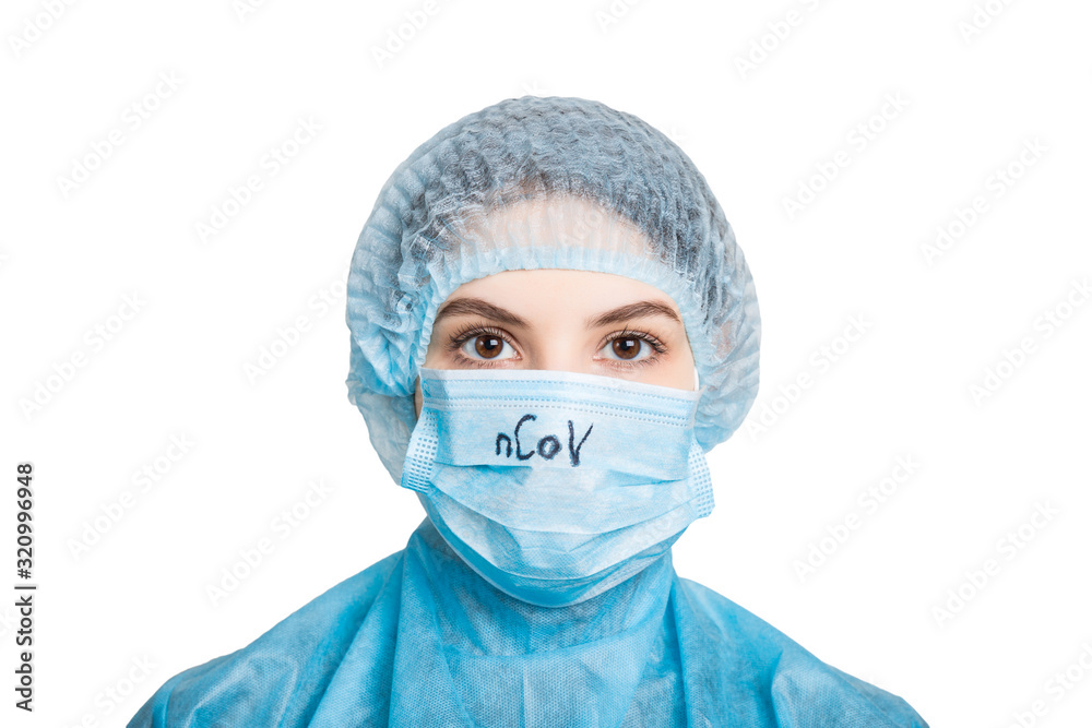 Portrait of young woman wearing medical uniform and mask with nCoV text isolated on white background. Protect your health. Coronavirus concept