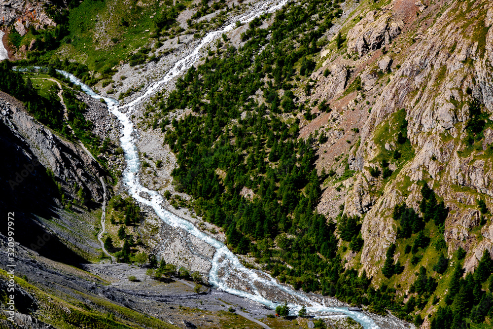 Top view of a mountain river in the Alps.