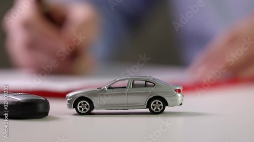 buy new car concept - signing contract in office photo