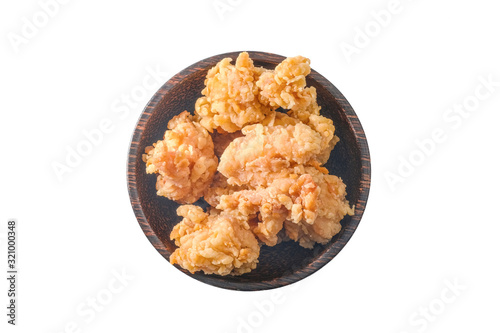 (Top view)Fried Chicken cut into pieces in a wooden bowl isolated on white background.