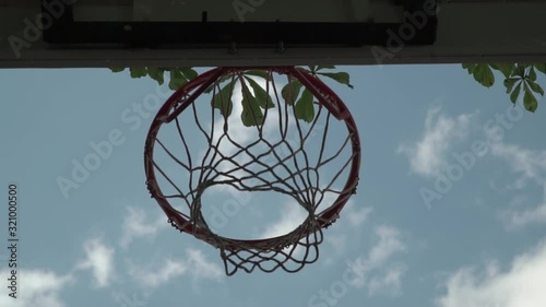 basketball hoop at cloudy sky background