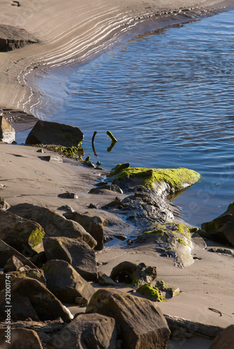 Surat Bay Owaka beach. Catlins New Zealand. Sand and water. Shoreline. photo