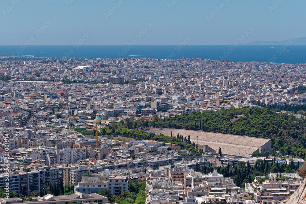Naklejka premium Athens Greece cityscape with the ancient stadium and Saronic golf in the background