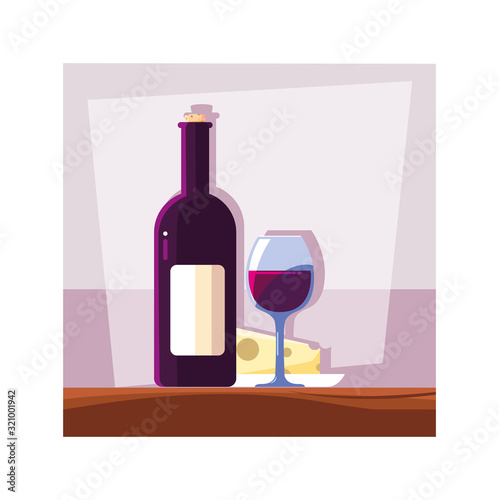 bottle and glass of wine with piece of cheese