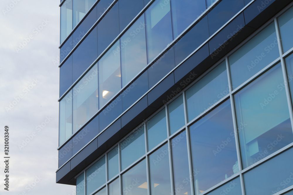 office tower blue building corner glass windows skyscraper architecture