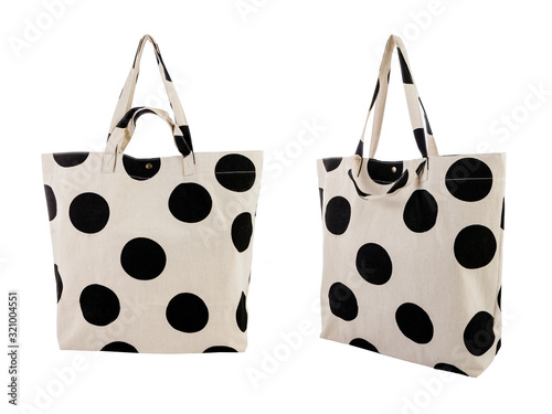 White canvas bag with random black dots pattern isolated on white background.