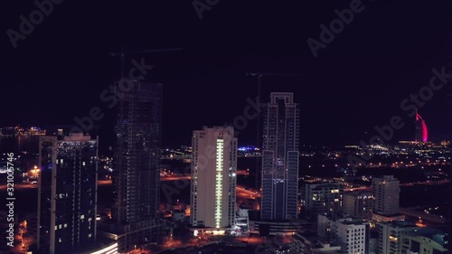 Wallpaper Mural Aerial night illuminated Dubai city skyline skyscrapers view and  busy traffic on Sheikh Zayed road  highway Torontodigital.ca