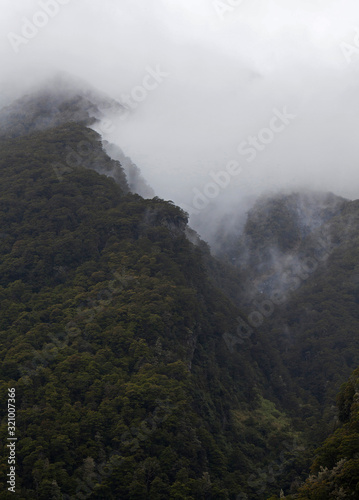 Mount aspiring National Park New Zealand. mountains and clouds. Fog