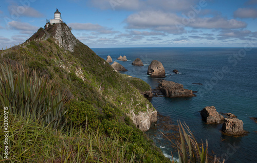 Lighthouse. Nugget Point coast. Catlins New Zealand. Rocks ocean